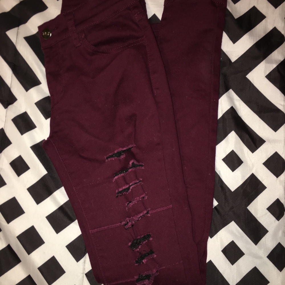 Ripped jeans that are black & burgundy